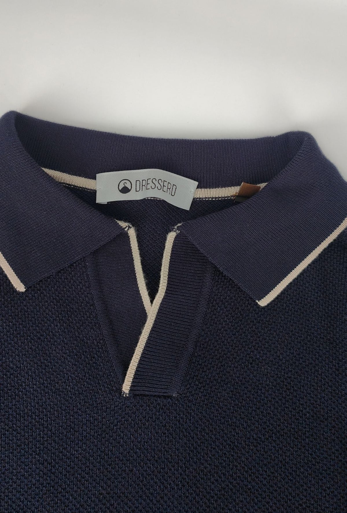 Polo de hombre Dresserd de manga larga en punto azul marino con escote Derby
