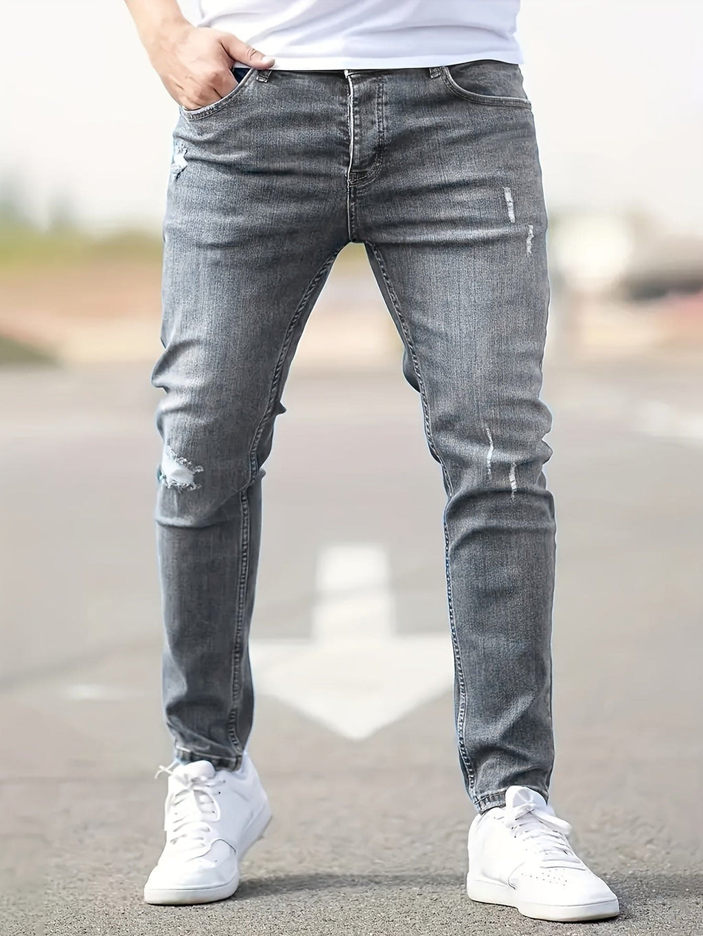 Jeans slim fit para hombre con detalles desgastados