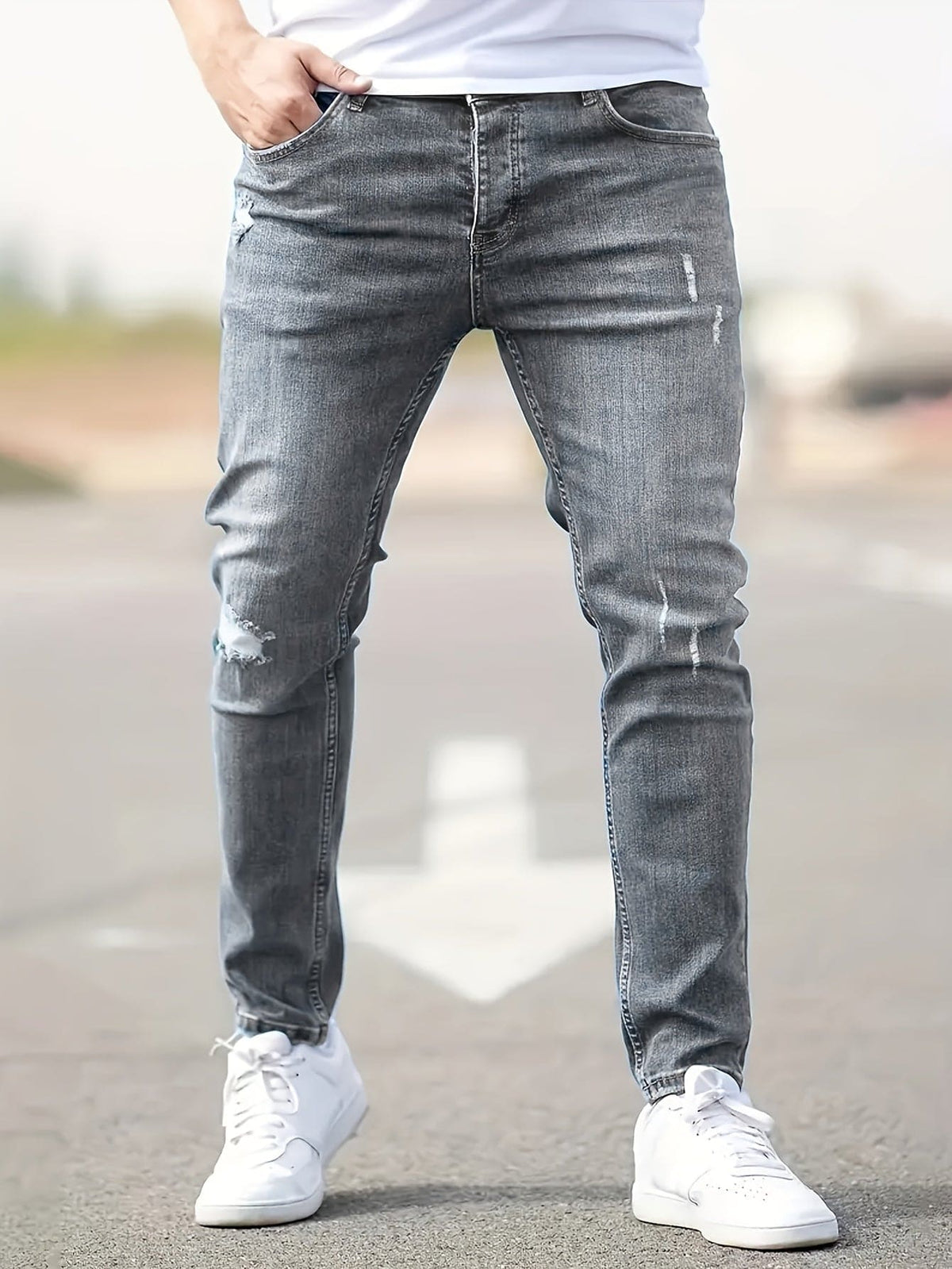 Jeans slim fit para hombre con detalles desgastados