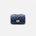 Bolso mini bandolera acolchado negro con cadena y piel