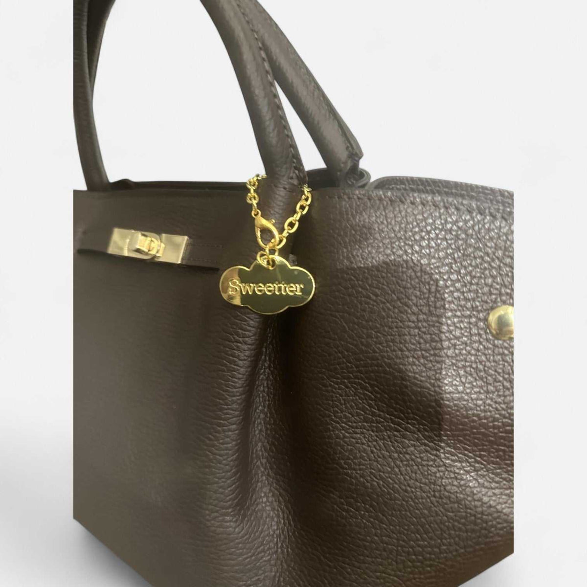 Bolso Cassandra chocolate de piel de vacuno con cierre giratorio