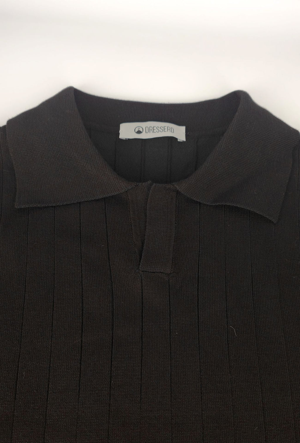 Polo de hombre Dresserd negro en punto de canalé