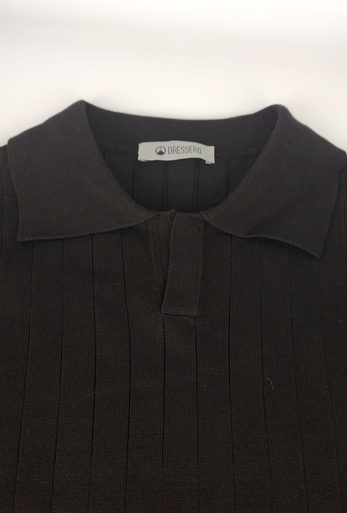 Polo de hombre Dresserd negro en punto de canalé