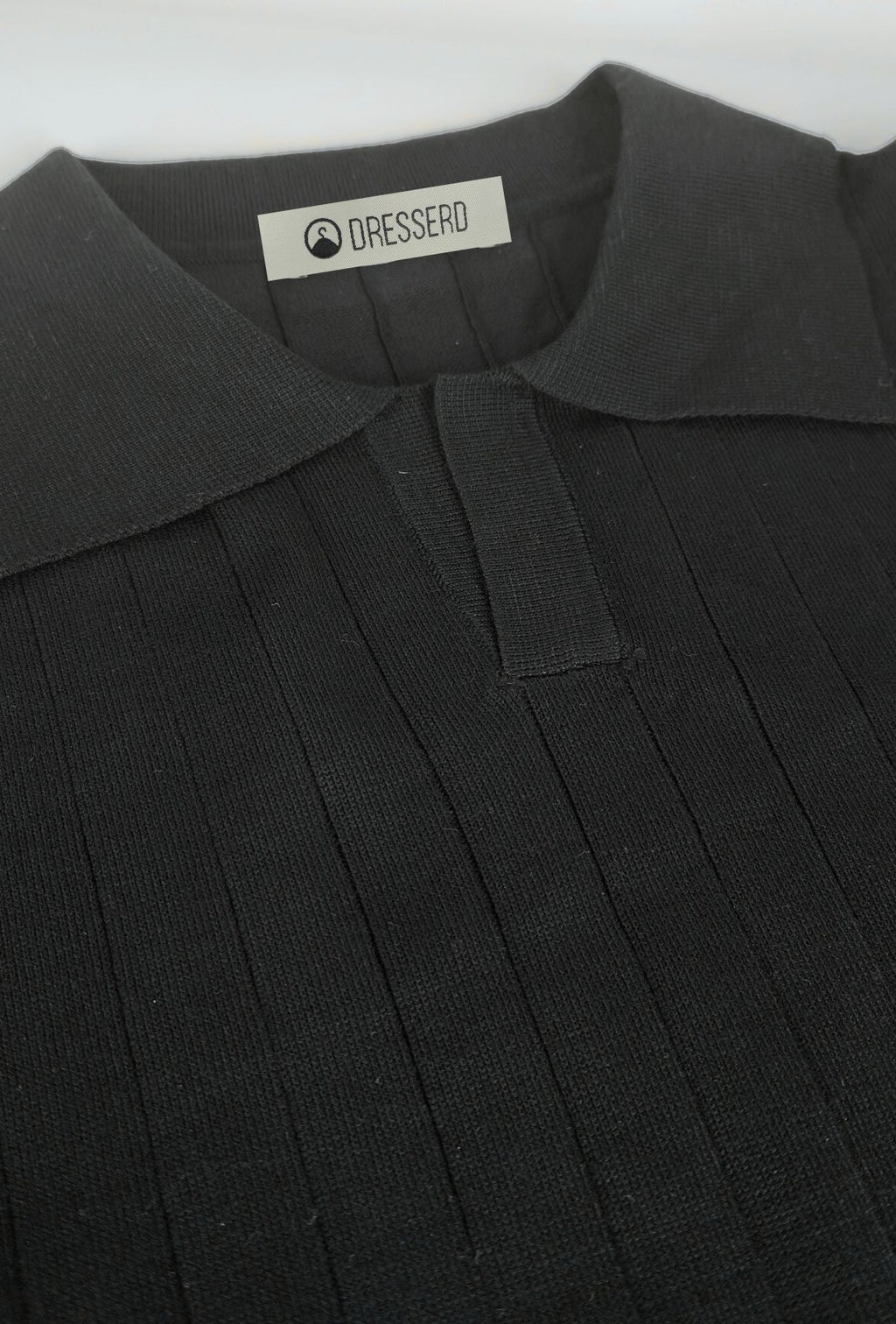 Polo de hombre Dresserd negro en punto de canalé
