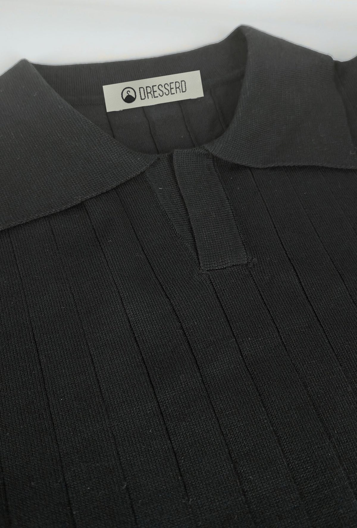 Polo de hombre Dresserd negro en punto de canalé
